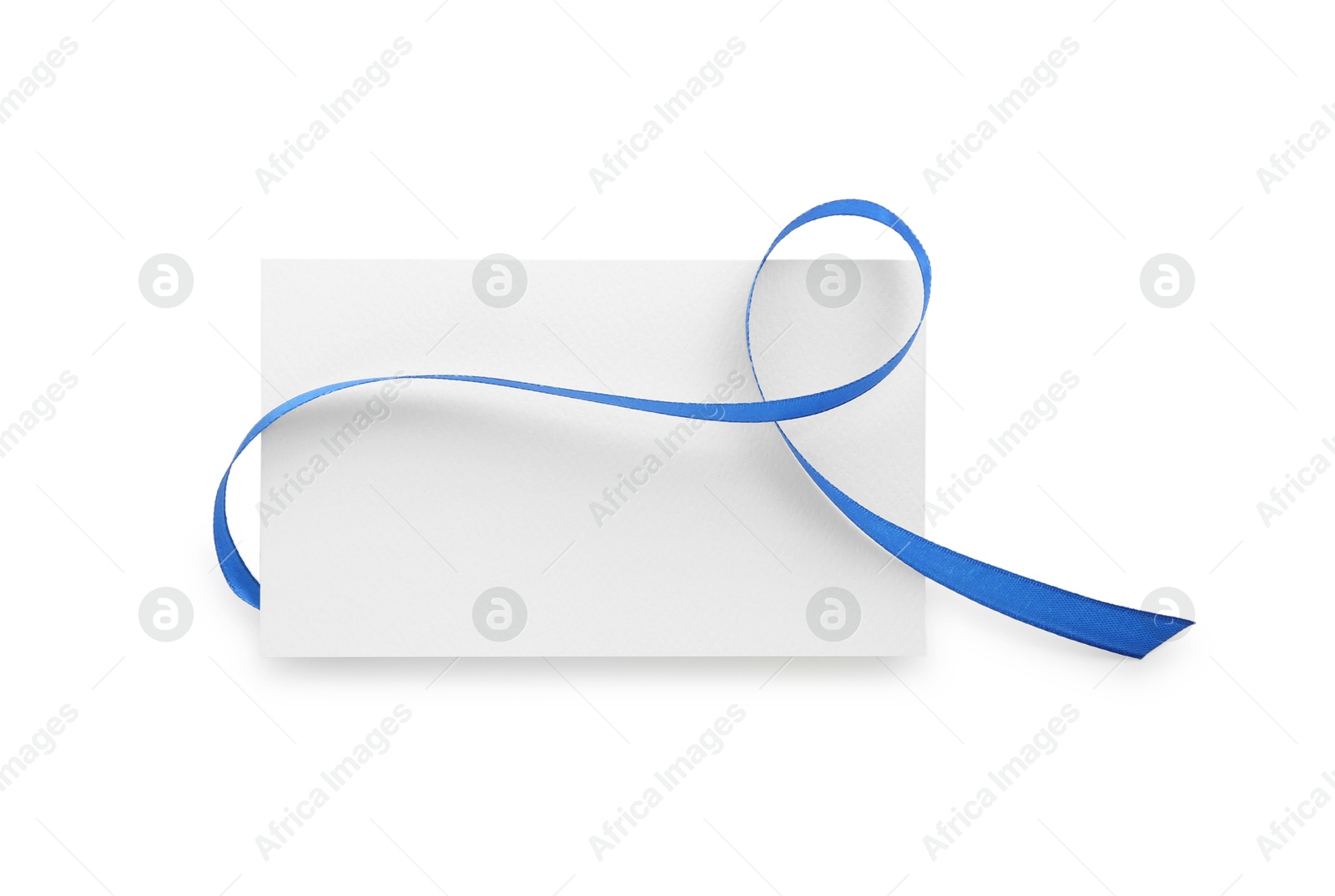 Photo of Blank card and blue ribbon isolated on white, top view