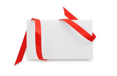 Photo of Blank card and red ribbon isolated on white, top view