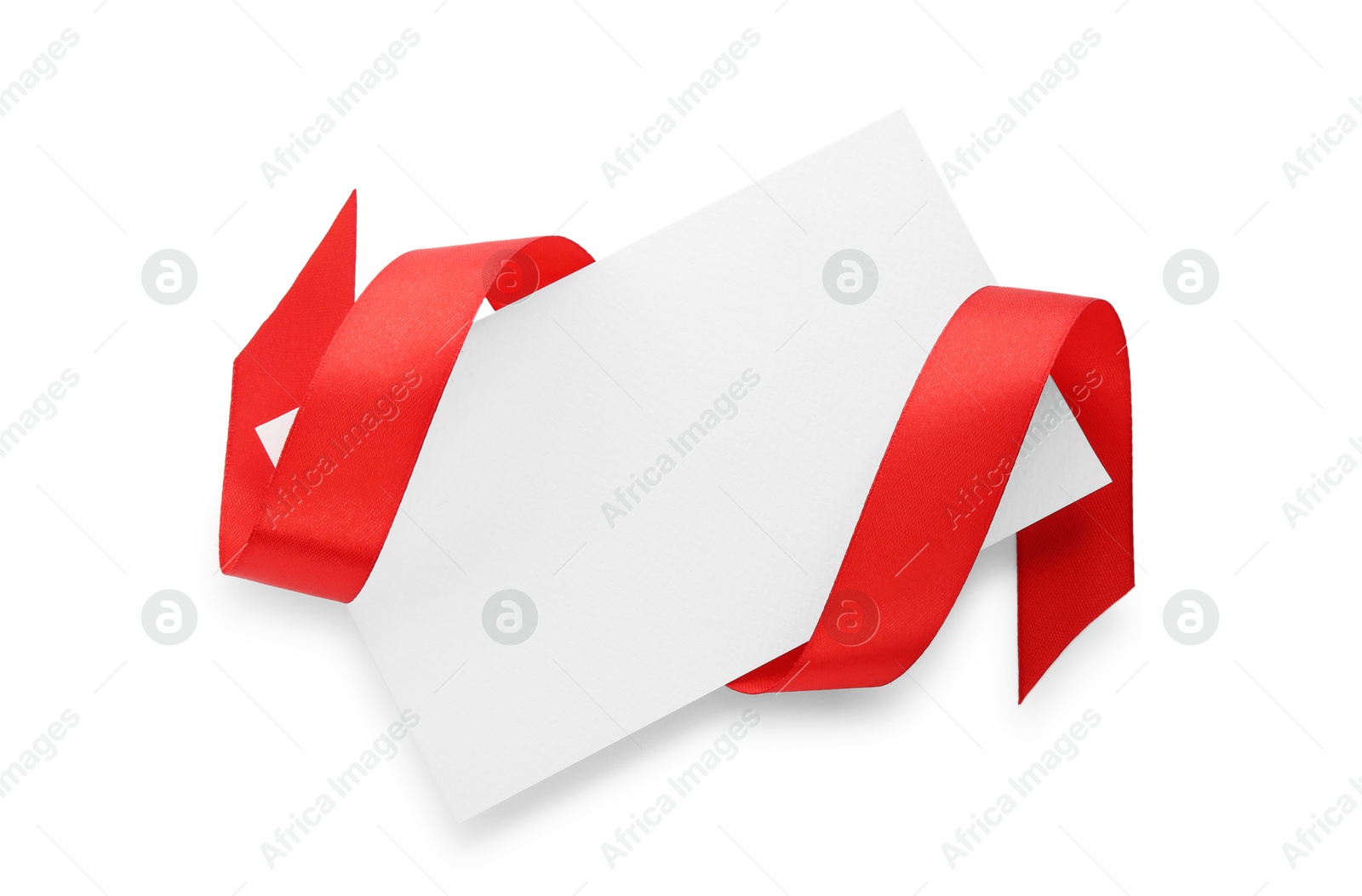 Photo of Blank card and red ribbon isolated on white, top view