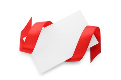 Blank card and red ribbon isolated on white, top view