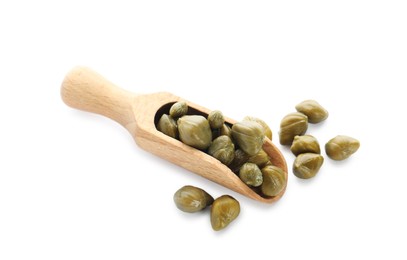 Wooden scoop and capers on white background