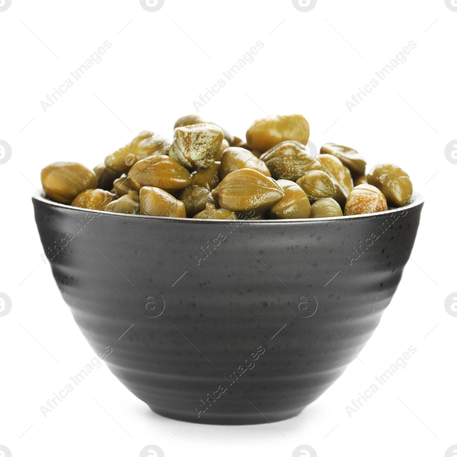 Photo of Many capers in bowl isolated on white