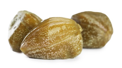 Three delicious pickled capers on white background