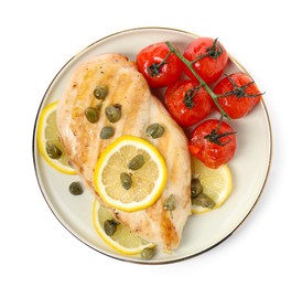 Photo of Delicious cooked chicken fillet with capers, tomatoes and lemon on white background, top view