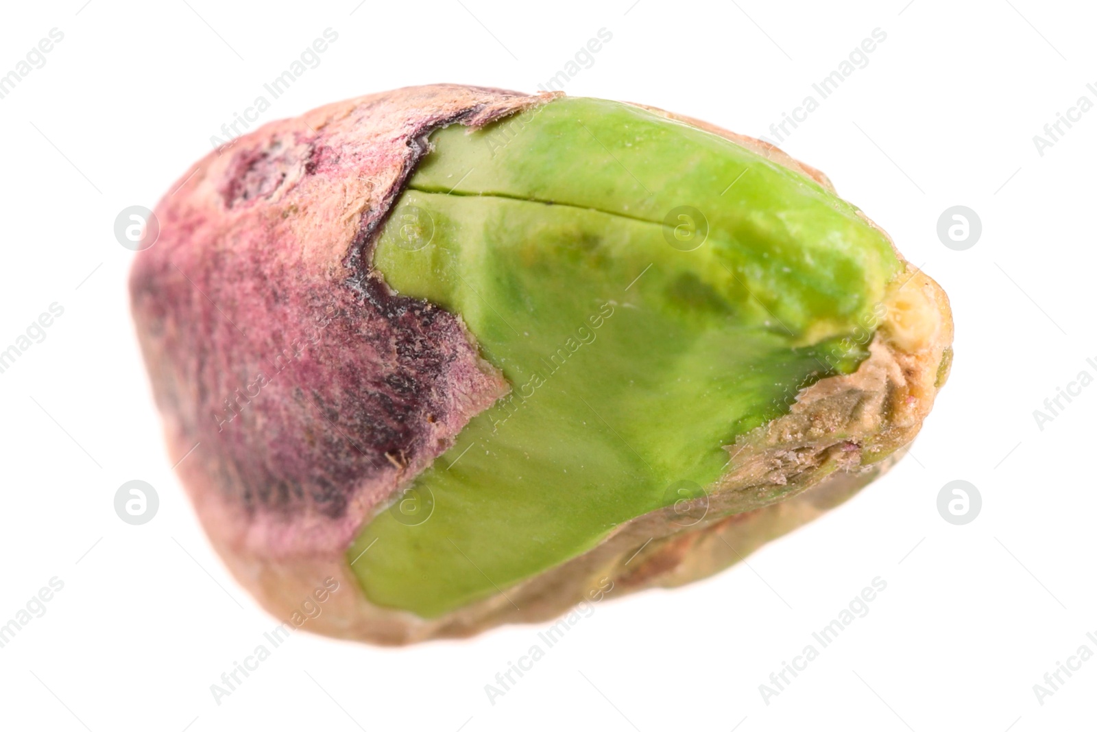 Photo of One peeled pistachio nut isolated on white