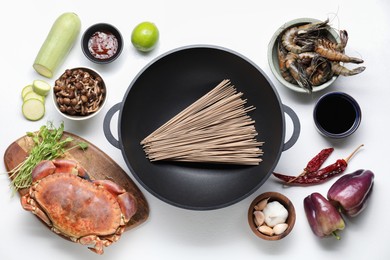 Photo of Different ingredients for wok on white table, flat lay