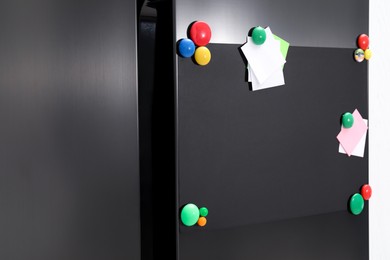 Photo of Blank magnetic board with notes on refrigerator in kitchen