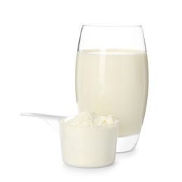 Photo of Delicious protein shake in glass and scoop with powder isolated on white