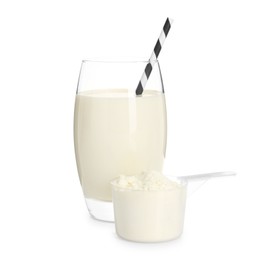 Photo of Delicious protein shake in glass and scoop with powder isolated on white