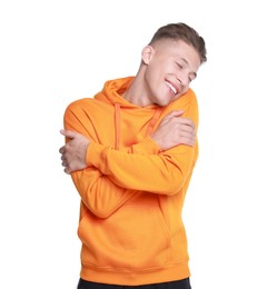 Photo of Young man hugging himself on white background