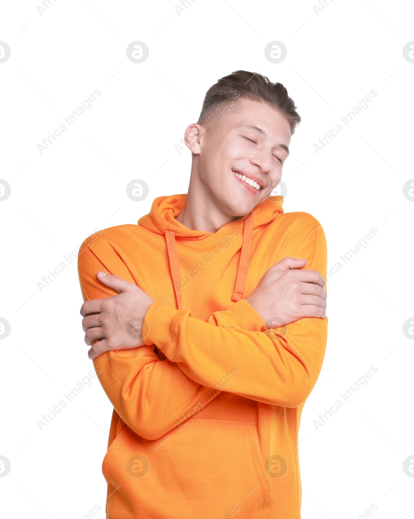 Photo of Young man hugging himself on white background