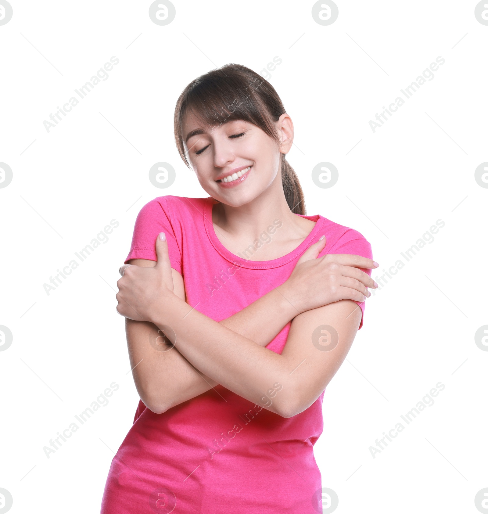 Photo of Young woman hugging himself on white background