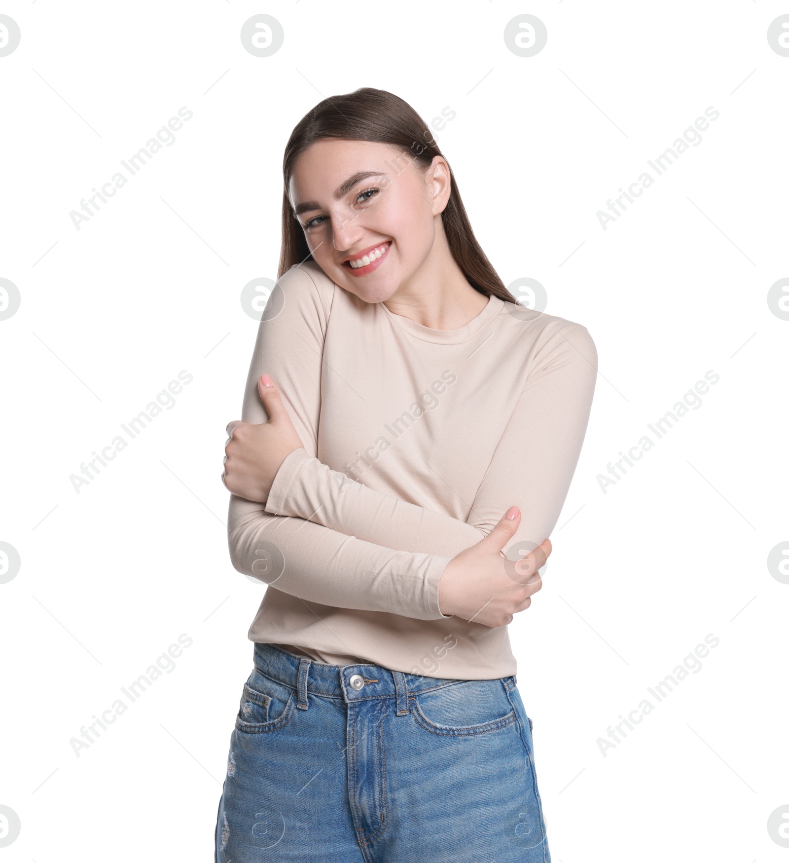 Photo of Charming young woman hugging herself on white background