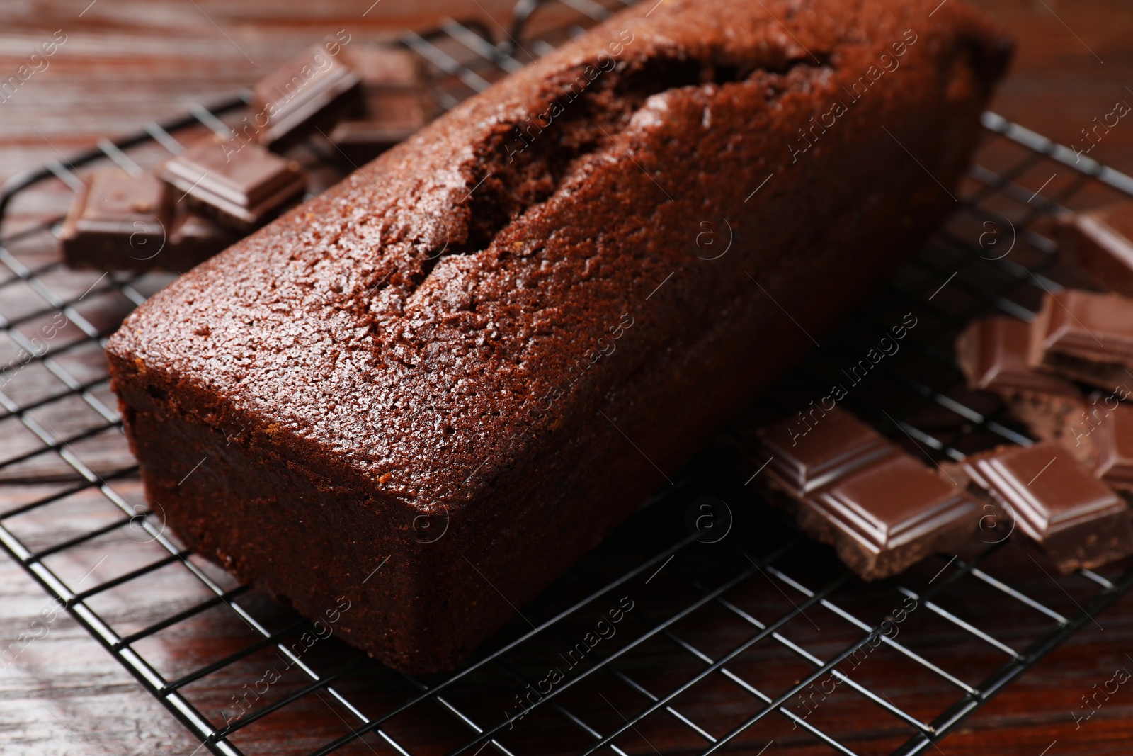 Photo of Tasty chocolate sponge cake on table, closeup