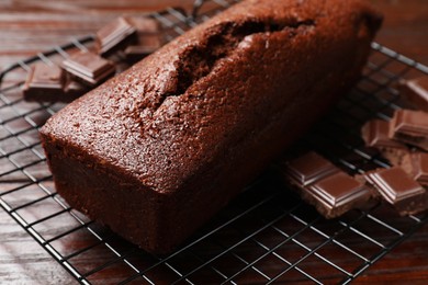 Photo of Tasty chocolate sponge cake on table, closeup