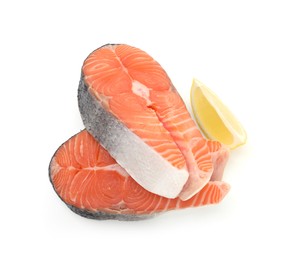 Steaks of fresh raw salmon and lemon isolated on white