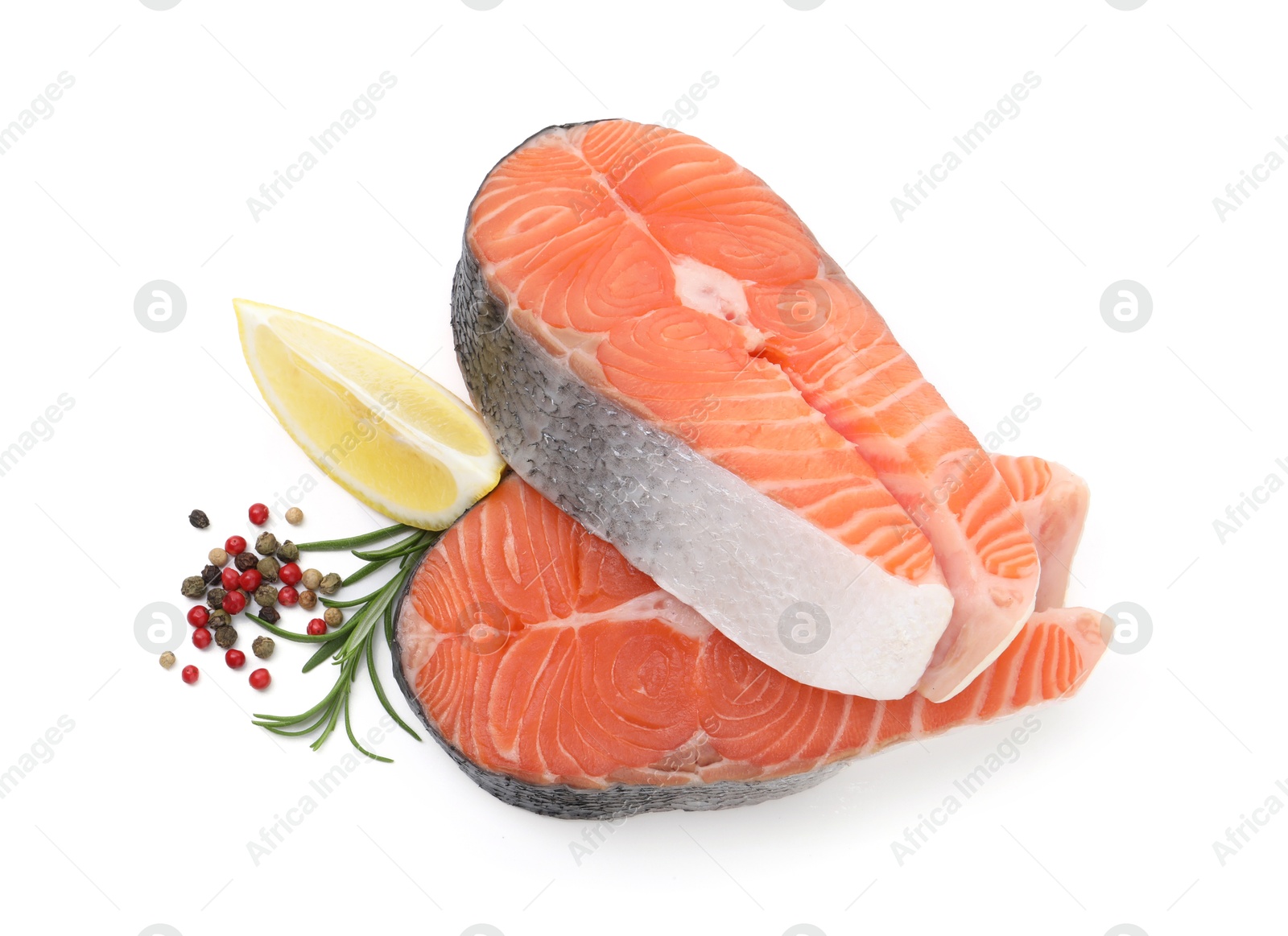 Photo of Fresh raw salmon steaks and spices isolated on white