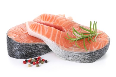 Photo of Steaks of fresh raw salmon and spices isolated on white