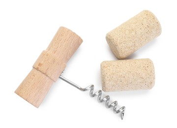 Photo of Corkscrew with wooden handle and corks isolated on white, top view