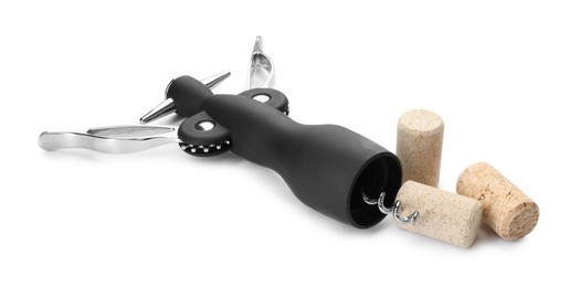 Photo of Wing corkscrew and corks isolated on white