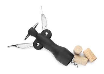 Wing corkscrew and corks isolated on white, top view