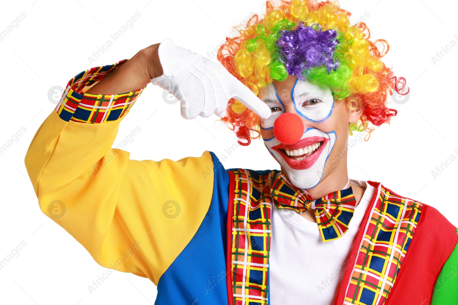 Photo of Portrait of happy clown pointing at his nose on white background