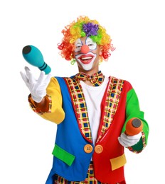 Photo of Happy clown juggling clubs on white background