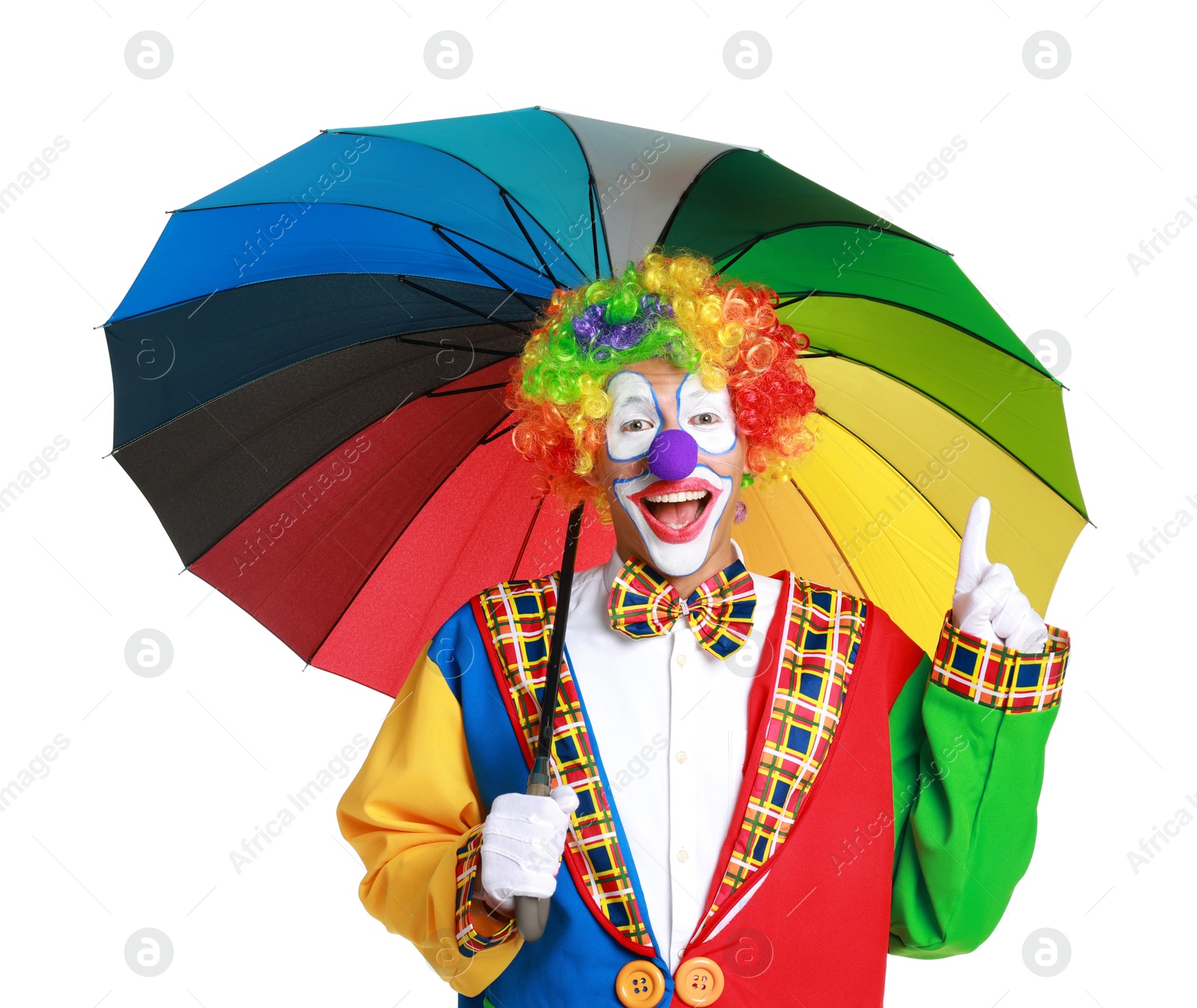 Photo of Happy clown with colorful umbrella on white background