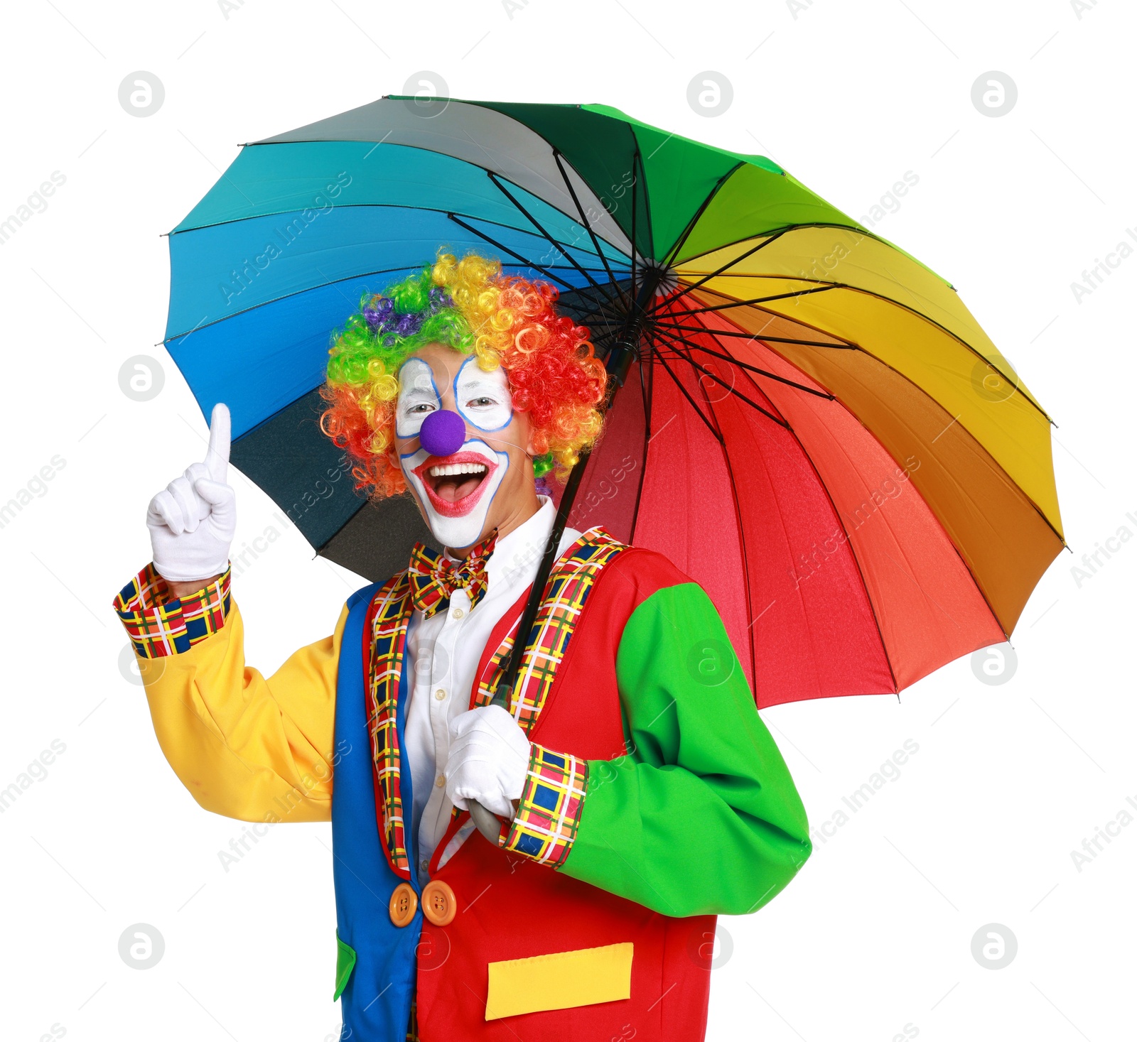 Photo of Happy clown with colorful umbrella on white background