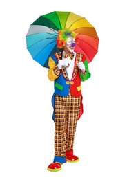 Happy clown with colorful umbrella on white background