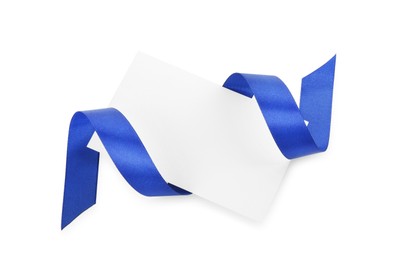 Photo of Blank card and blue ribbon isolated on white, top view