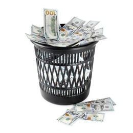 Photo of Many dollar banknotes in trash bin isolated on white