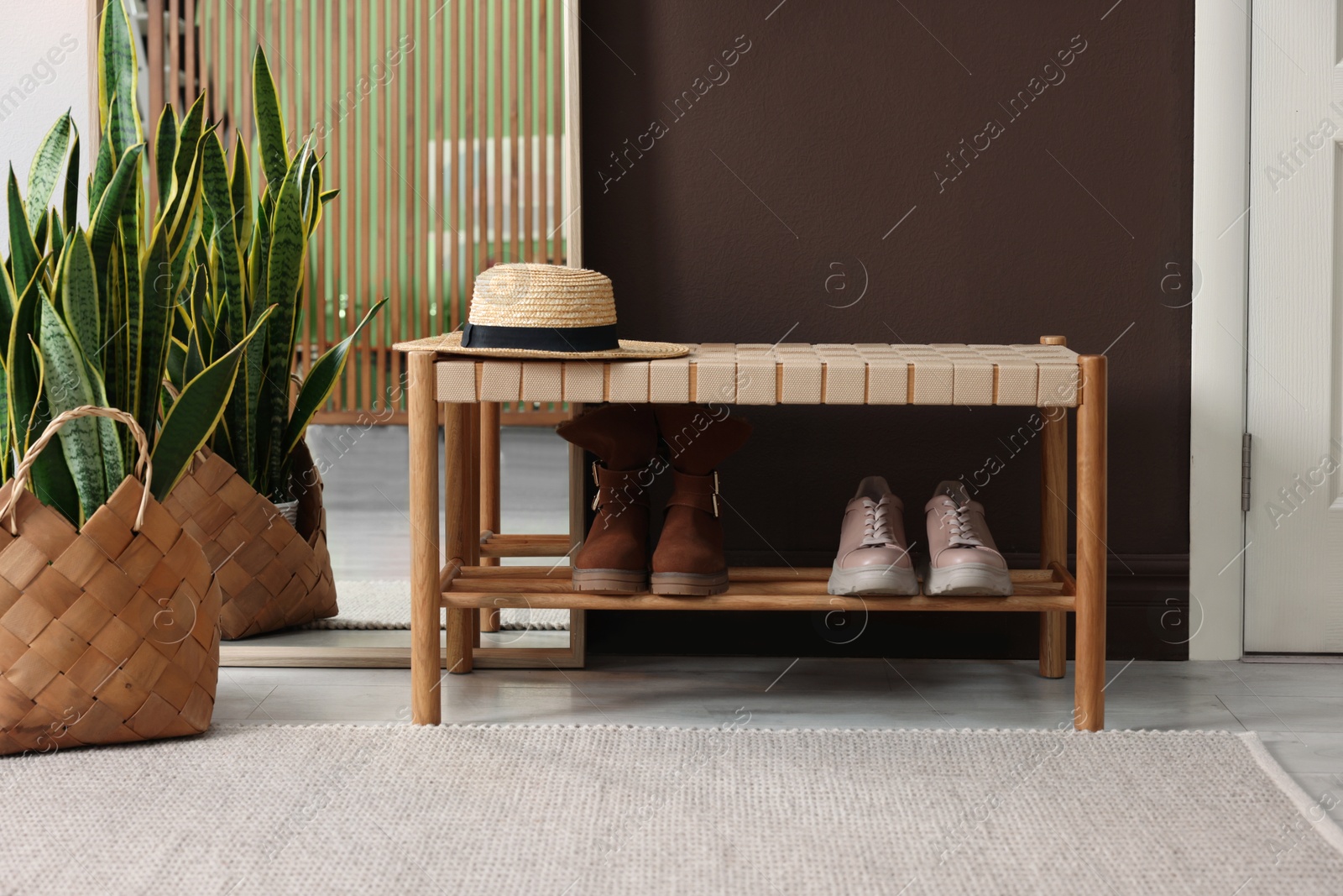 Photo of Stylish hallway interior with mirror and bench