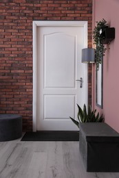 Photo of Stylish hallway interior with mirror and lamp