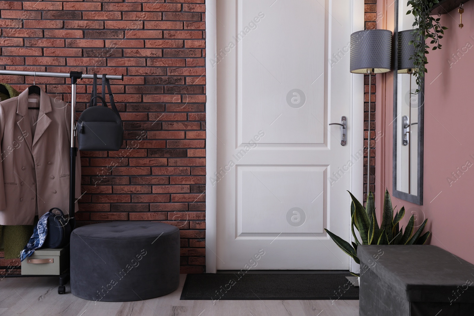 Photo of Stylish hallway interior with coat rack and mirror