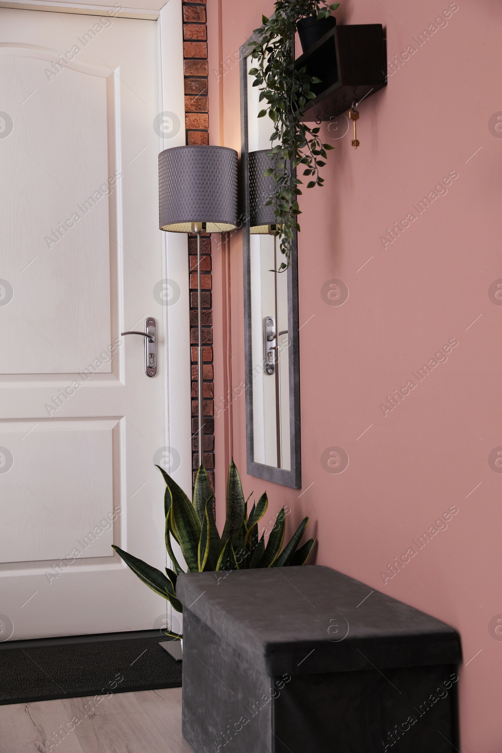 Photo of Stylish hallway interior with mirror and lamp