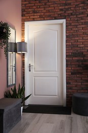 Photo of Stylish hallway interior with mirror and lamp