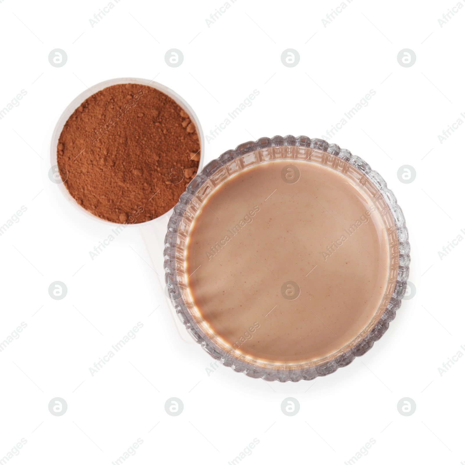 Photo of Delicious protein shake in glass and scoop with powder isolated on white, top view