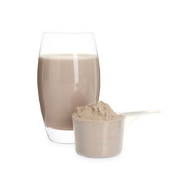 Photo of Delicious protein shake in glass and scoop with powder isolated on white