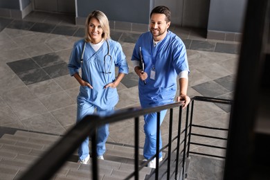 Healthcare workers with clipboard and stethoscope in hospital