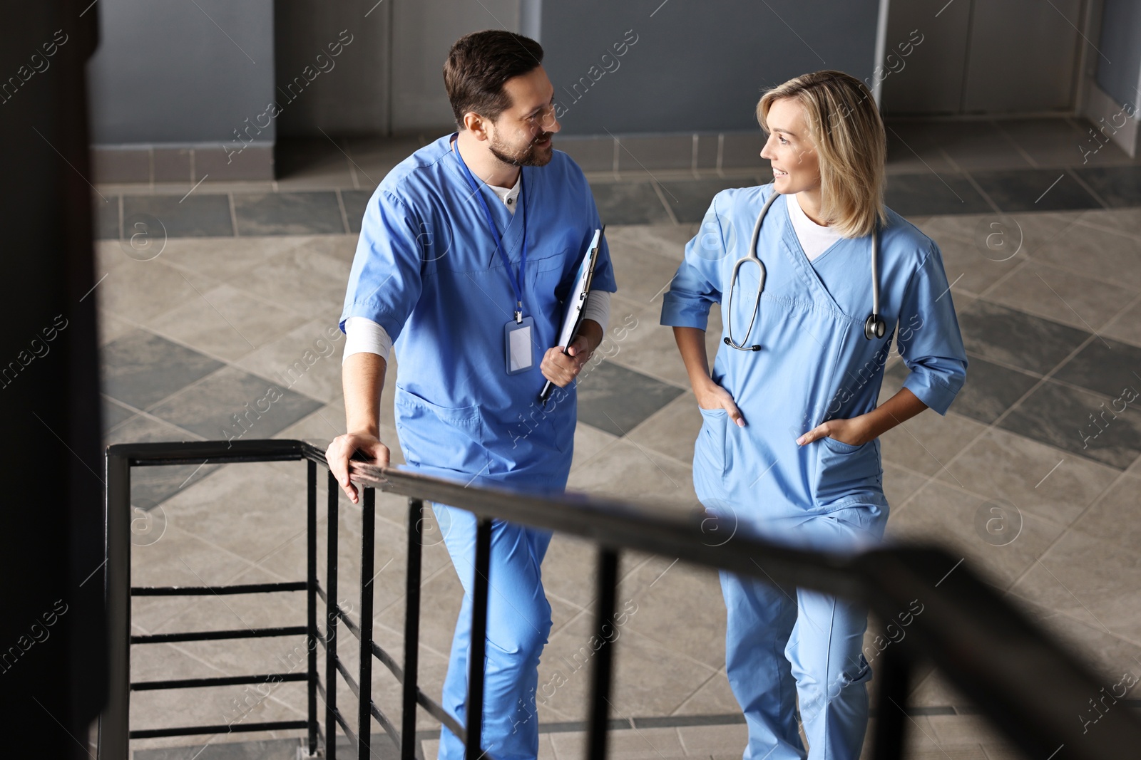 Photo of Healthcare workers with clipboard and stethoscope in hospital