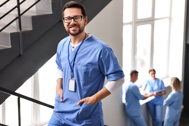 Healthcare workers in hospital, selective focus. Smiling nurse indoors