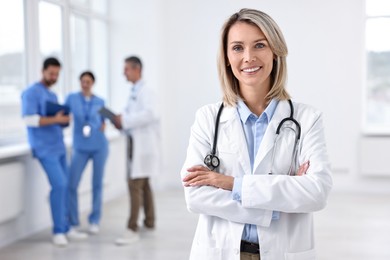 Healthcare workers in hospital, selective focus. Portrait of smiling nurse indoors