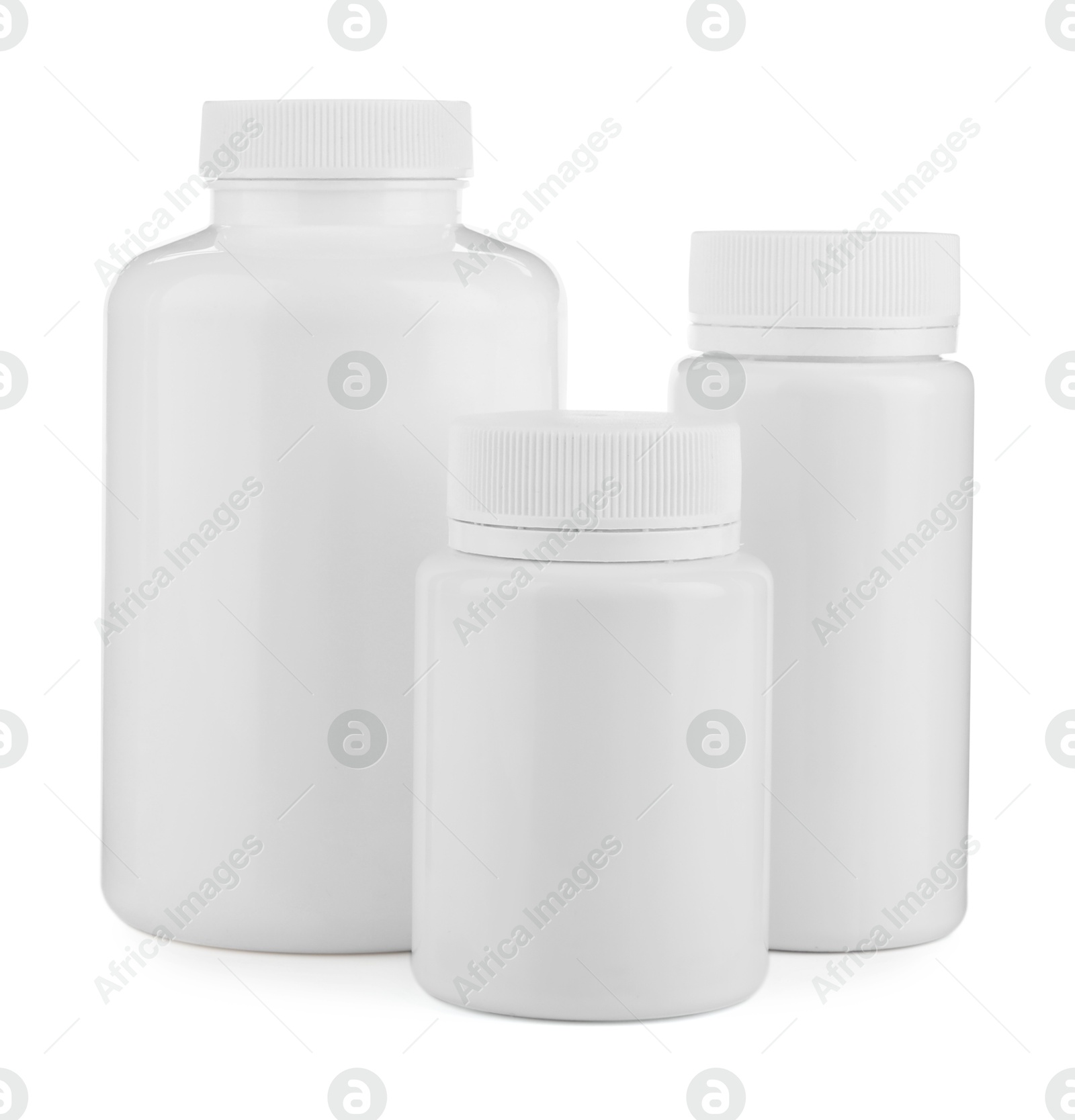 Photo of Three plastic medical bottles isolated on white