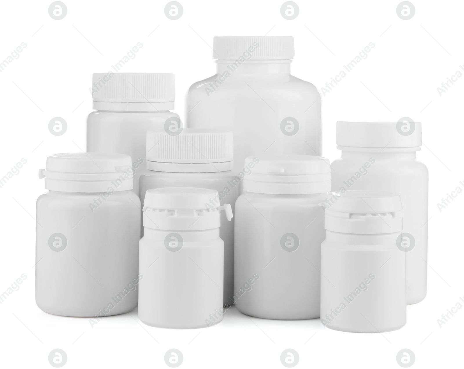 Photo of Many plastic medical bottles isolated on white