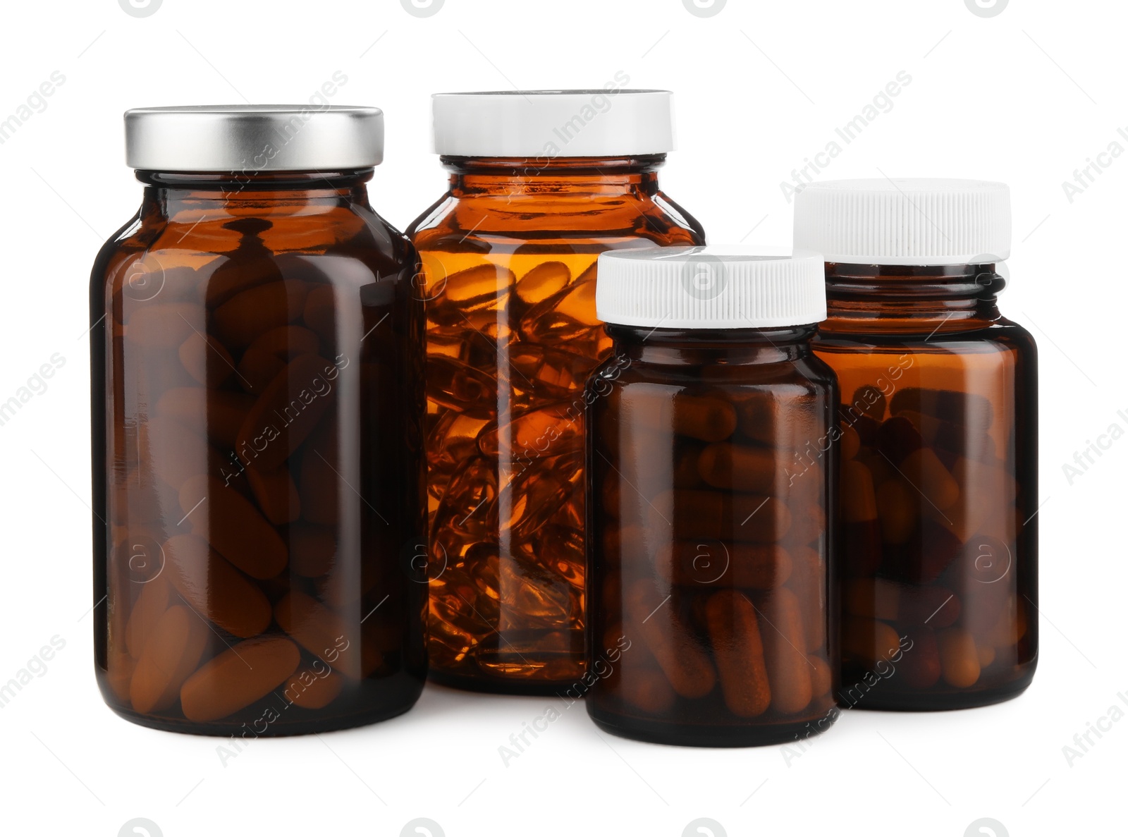 Photo of Medical bottles with pills isolated on white