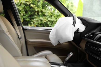 Opened airbag in automobile. Car safety equipment