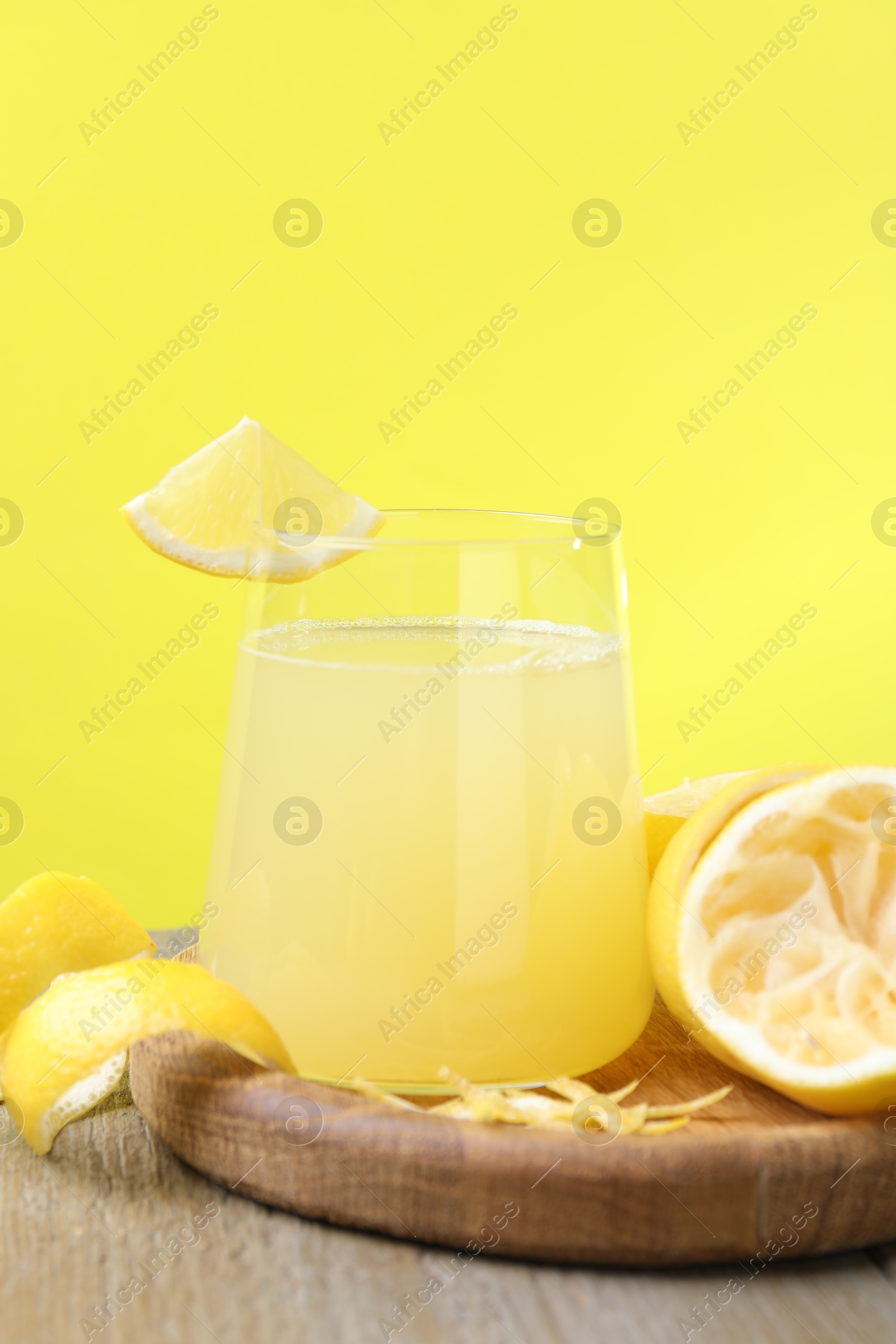 Photo of Glass of fresh juice and fruits on wooden table