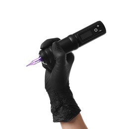 Professional artist in gloves holding tattoo machine on white background, closeup