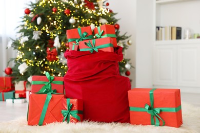 Photo of Santa bag full of Christmas presents at home